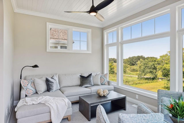 living room with ceiling fan, carpet, crown molding, and wooden ceiling