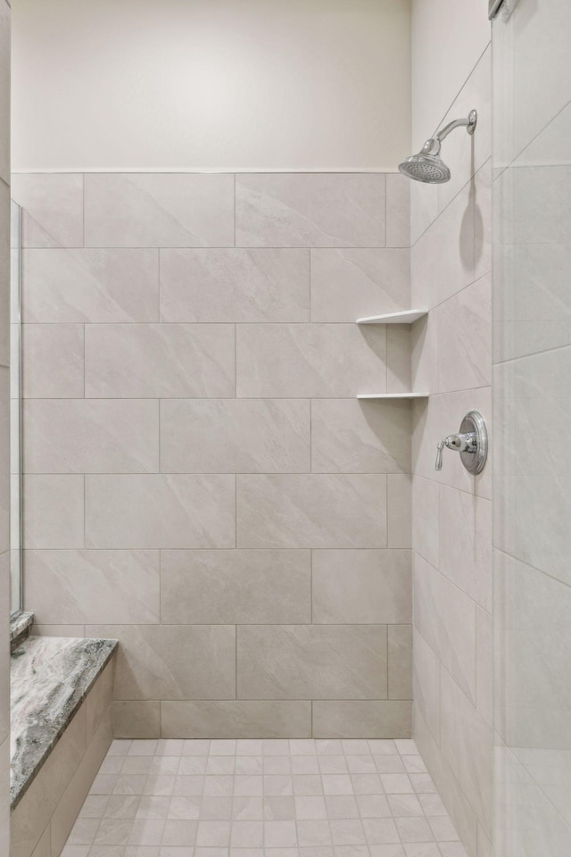 bathroom with tiled shower