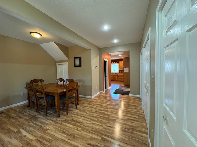 dining room with hardwood / wood-style flooring