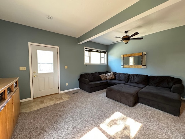 living room with ceiling fan, light colored carpet, and beam ceiling