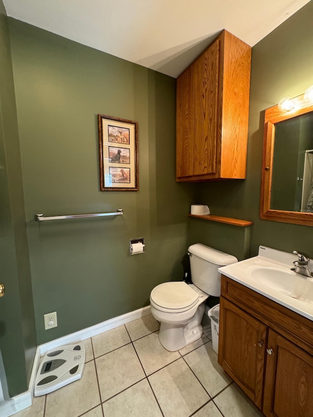 bathroom with tile patterned floors, toilet, and vanity