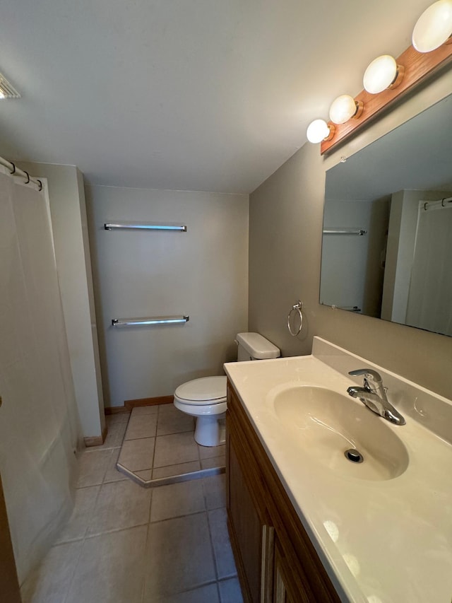 417 Pine St, Saint Peter, MN 56082 - bathroom with vanity, a shower with curtain, baseboards, toilet, and tile patterned flooring