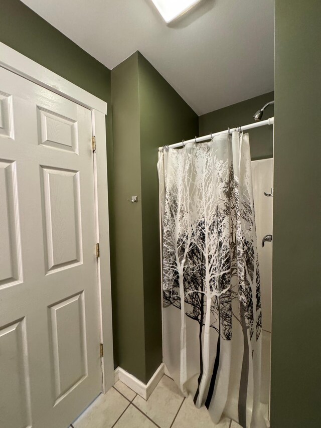 417 Pine St, Saint Peter, MN 56082 - bathroom featuring baseboards, tile patterned flooring, and a shower with shower curtain
