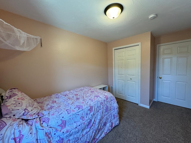 carpeted bedroom featuring a closet