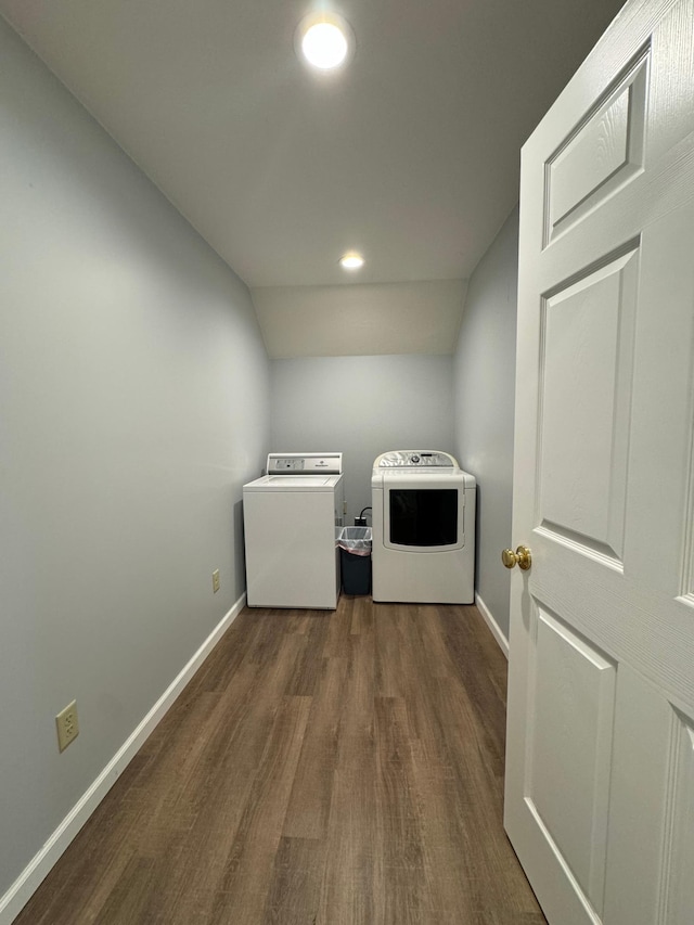 laundry room featuring dark hardwood / wood-style flooring and washing machine and clothes dryer