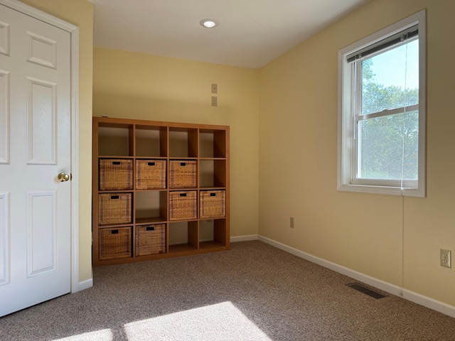 unfurnished bedroom with carpet flooring