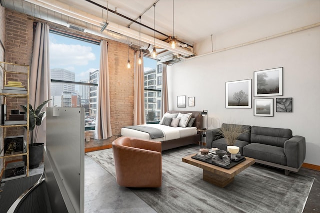 living room featuring hardwood / wood-style floors and brick wall