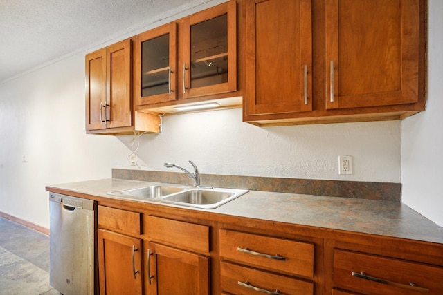 kitchen with dishwasher, sink, and a textured ceiling