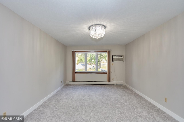 unfurnished room featuring an AC wall unit, an inviting chandelier, a baseboard heating unit, and light colored carpet