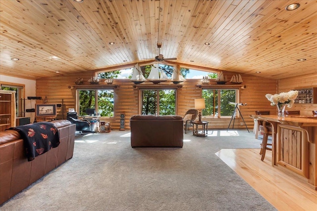 living area with lofted ceiling, carpet, wooden ceiling, and rustic walls