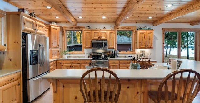 kitchen with wood ceiling, recessed lighting, appliances with stainless steel finishes, and light brown cabinetry