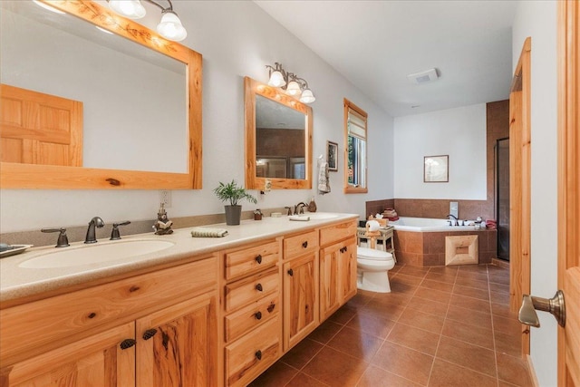 full bath with a sink, visible vents, a garden tub, and tile patterned flooring