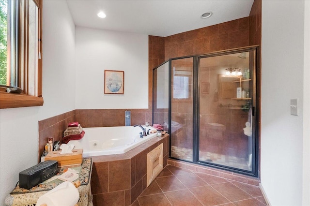 bathroom featuring recessed lighting, a tub with jets, a stall shower, and tile patterned flooring