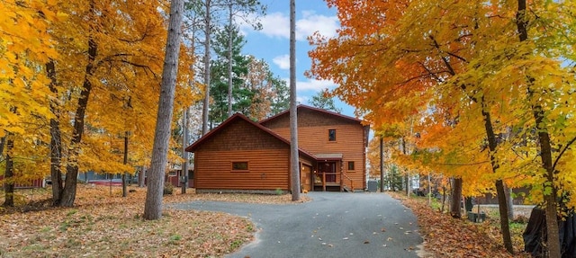 view of side of home featuring driveway