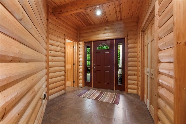 foyer entrance with beam ceiling and wood ceiling