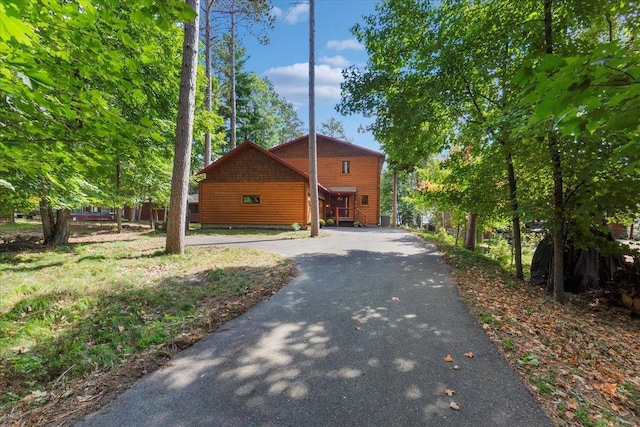 view of property exterior with aphalt driveway