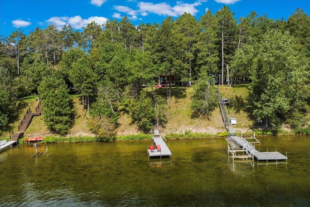 dock area featuring stairs and a water view