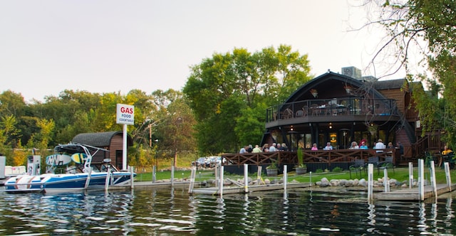 dock area featuring a water view and a balcony