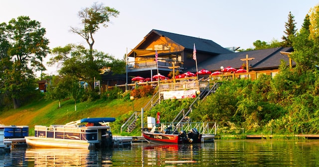 dock area featuring stairs and a water view