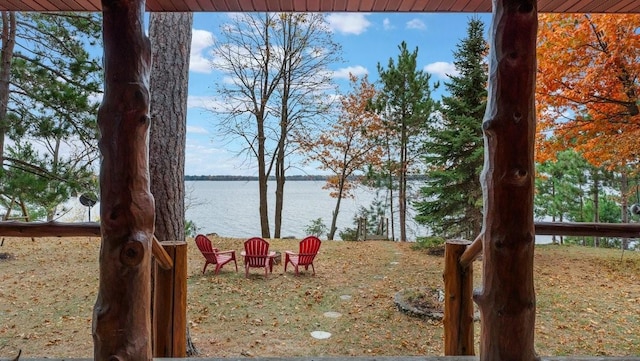 property view of water with an outdoor fire pit