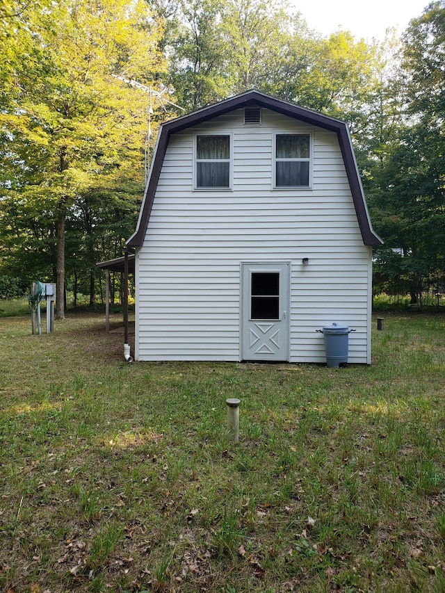 view of side of property with a yard