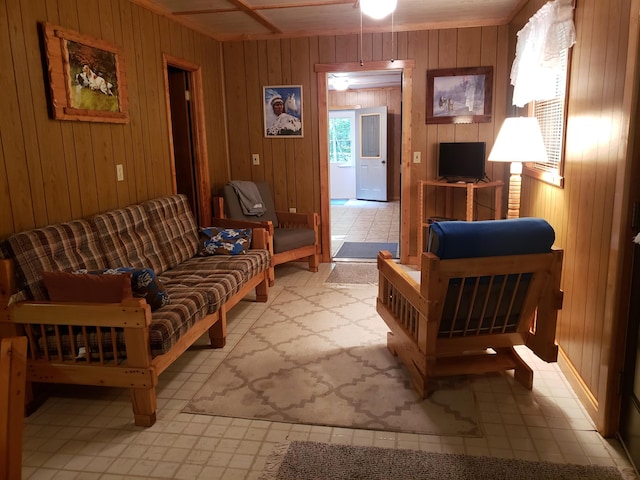 living room with wooden walls and ceiling fan