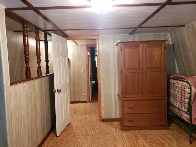 unfurnished bedroom with wood walls