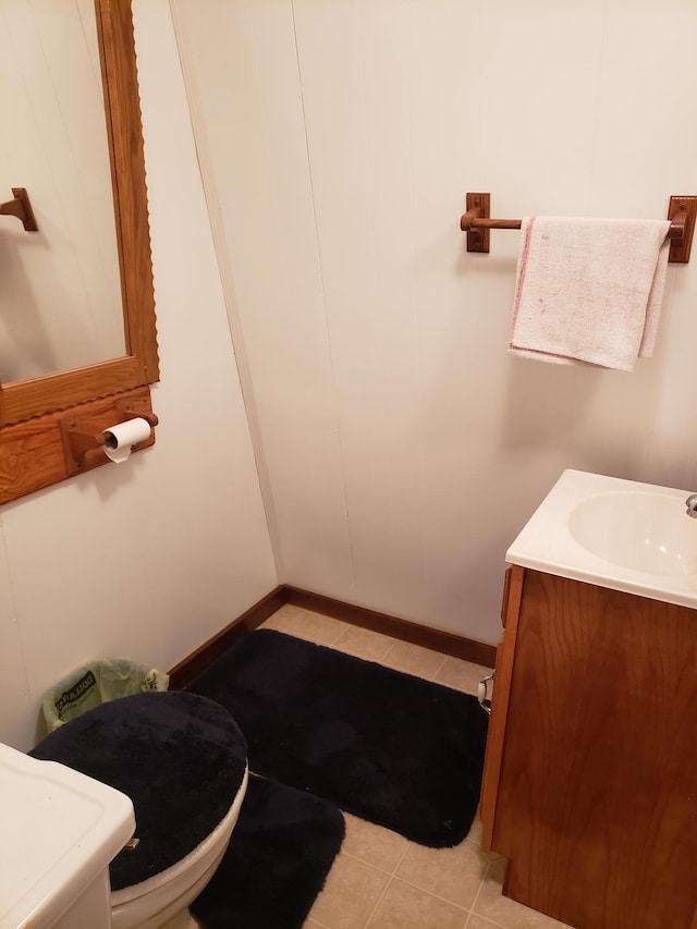 bathroom featuring vanity, toilet, and tile patterned floors