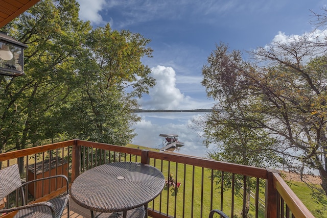 wooden deck with a lawn