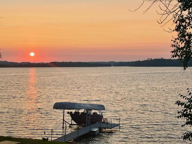 property view of water with a dock