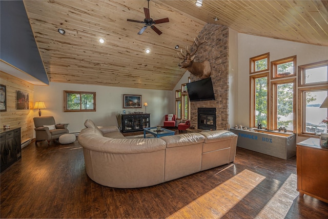 living room with wood ceiling, dark hardwood / wood-style floors, a fireplace, high vaulted ceiling, and ceiling fan