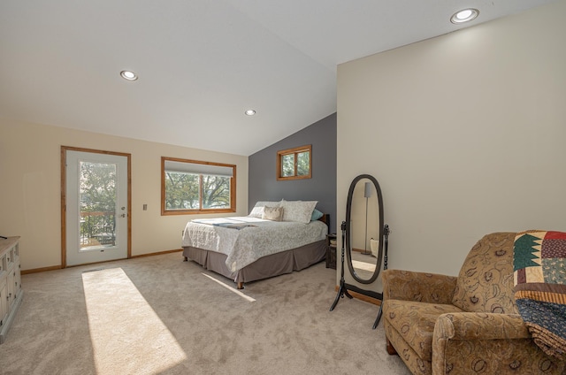 carpeted bedroom featuring vaulted ceiling and access to exterior