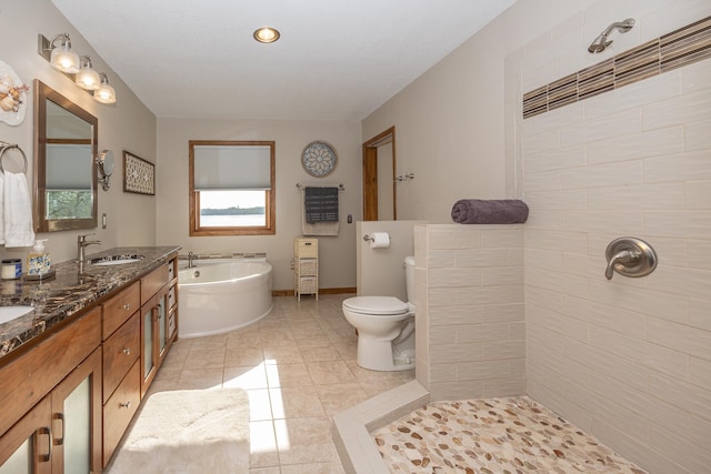 full bathroom with vanity, toilet, plus walk in shower, and tile patterned floors