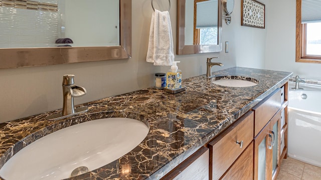 bathroom with tile patterned flooring and vanity