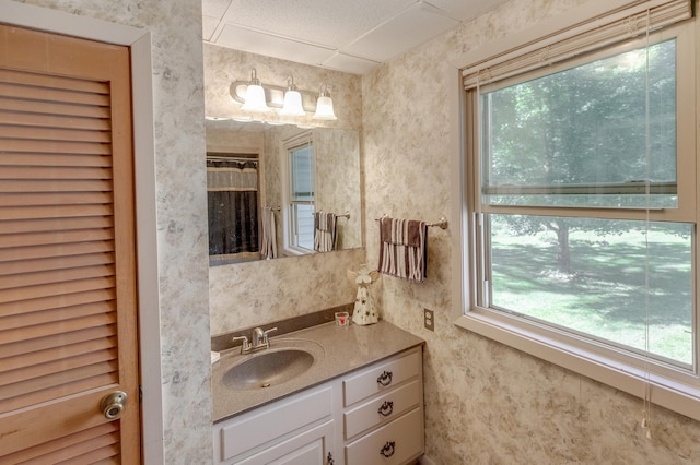 bathroom with vanity and curtained shower