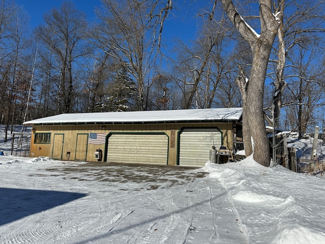 view of snow covered garage