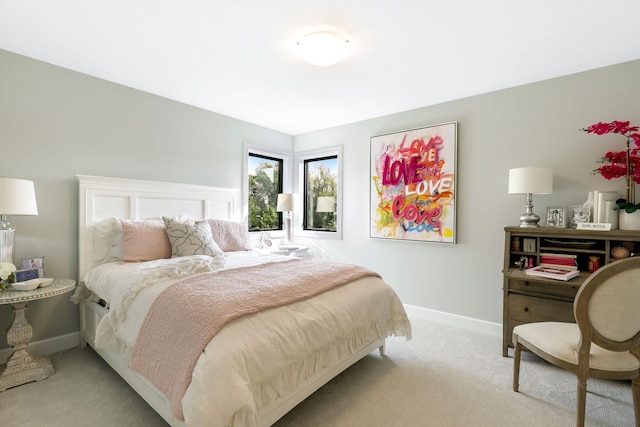 bedroom featuring light colored carpet