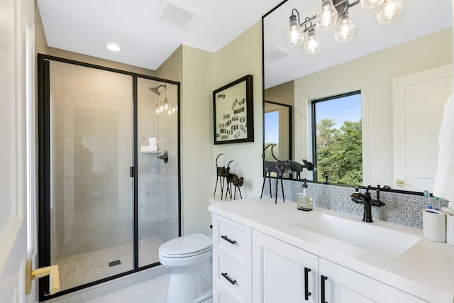 full bath with a stall shower, toilet, vanity, tile patterned flooring, and visible vents