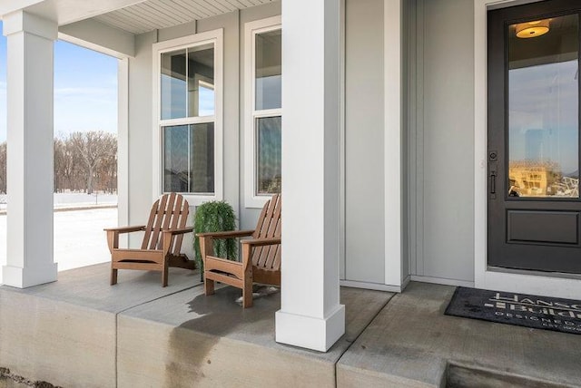 doorway to property featuring covered porch