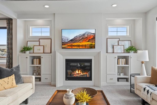 living room with light colored carpet and plenty of natural light