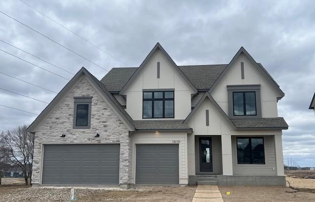 15170 110th Ave N, Dayton, MN 55369 - view of front of house with an attached garage, a shingled roof, and driveway