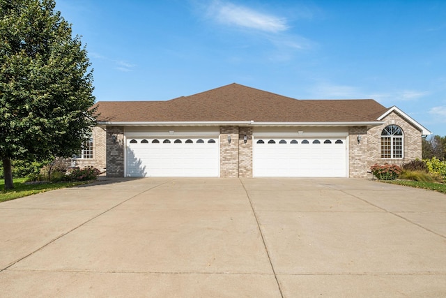 single story home featuring a garage