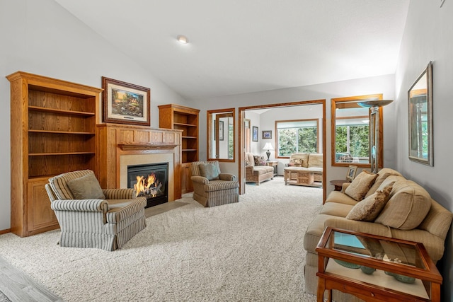 carpeted living room featuring lofted ceiling