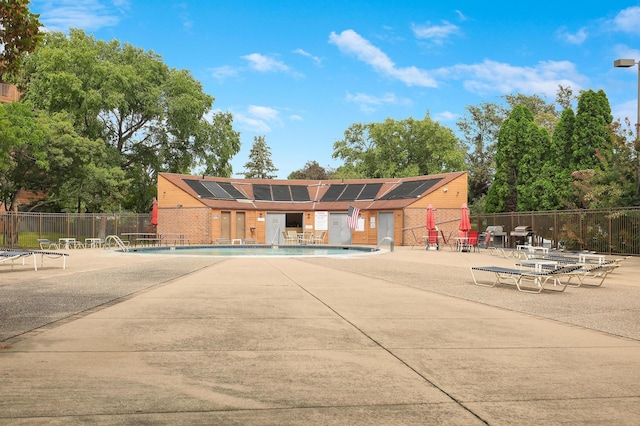 view of building exterior with a community pool