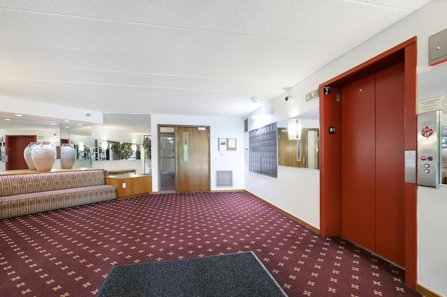 interior space with dark carpet and elevator