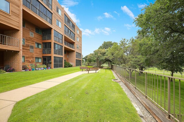 view of home's community featuring a yard