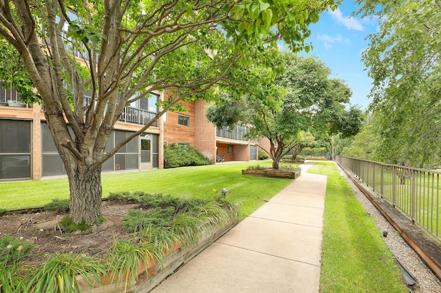 view of property's community with a yard