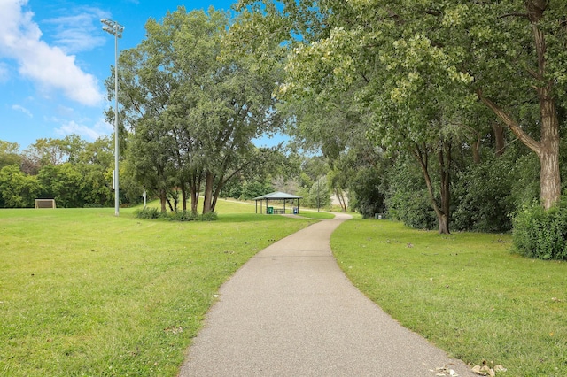 surrounding community with a lawn and a gazebo