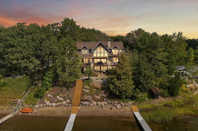 view of back house at dusk