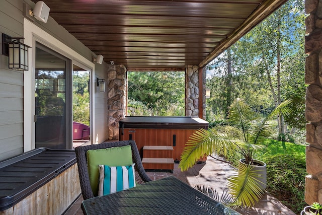 exterior space with a hot tub